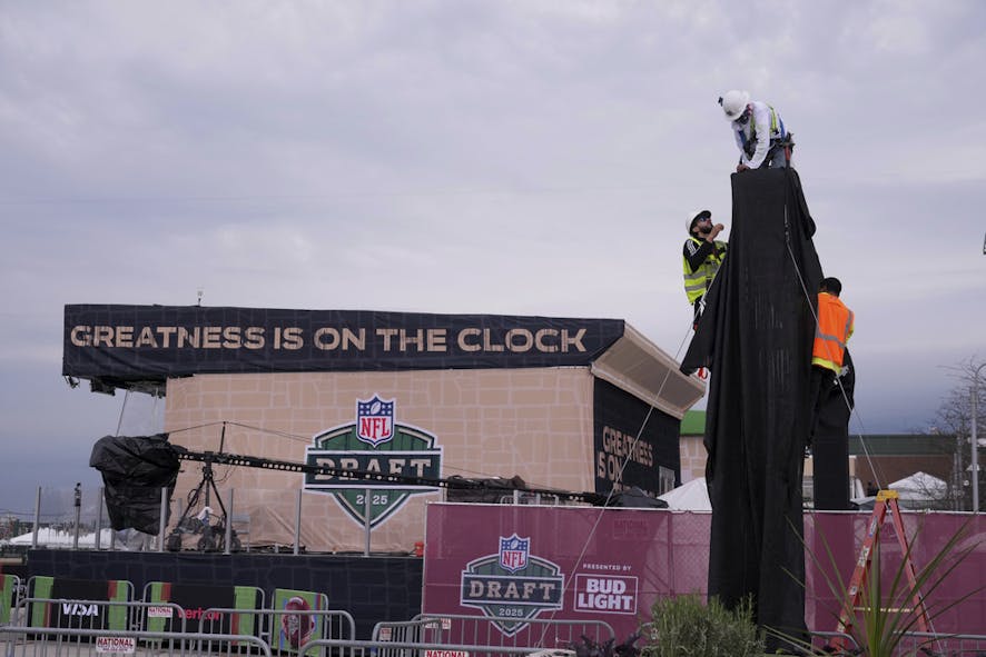 Workers prepare the venue ahead of the NFL football draft 
