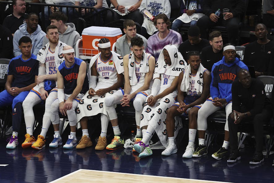 Oklahoma City Thunder players react from the bench