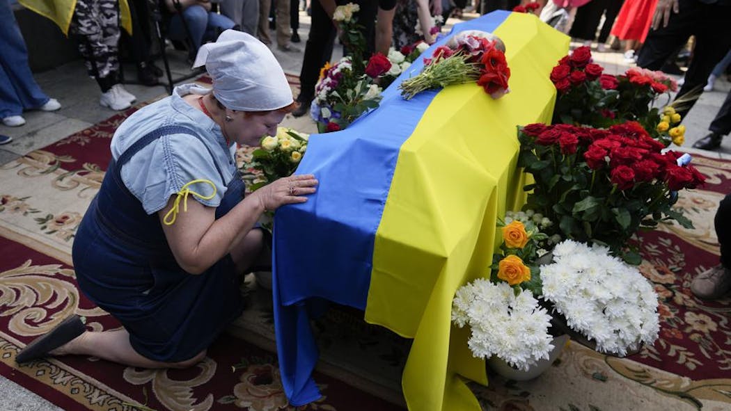 In Ukraine, Funeral For Activist Killed And Mourned In War